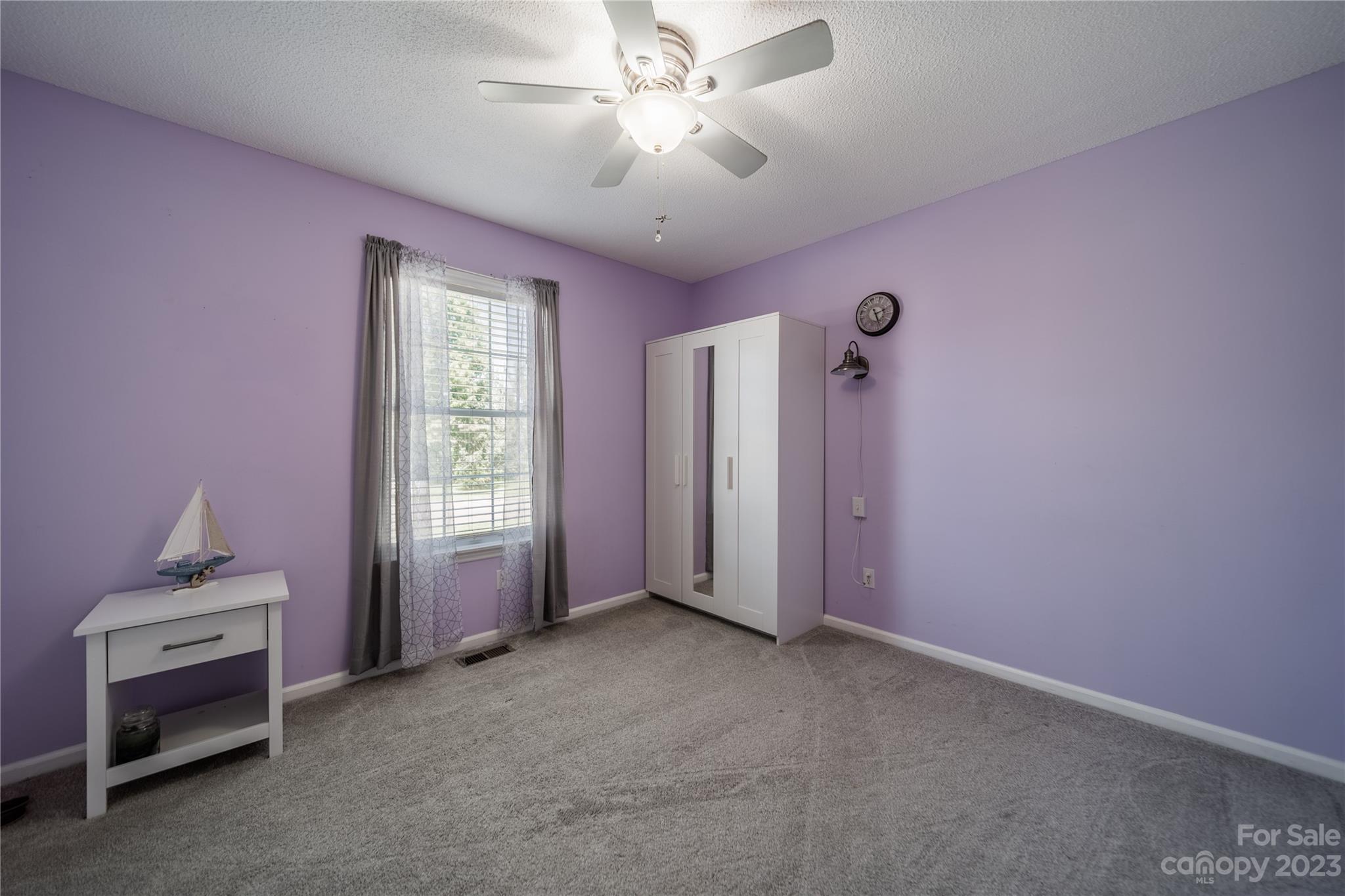 1585 Wimbleton Woods Drive Fort Mill, SC 29708 - Photo 27 of 41 a view of a livingroom with a ceiling fan and window