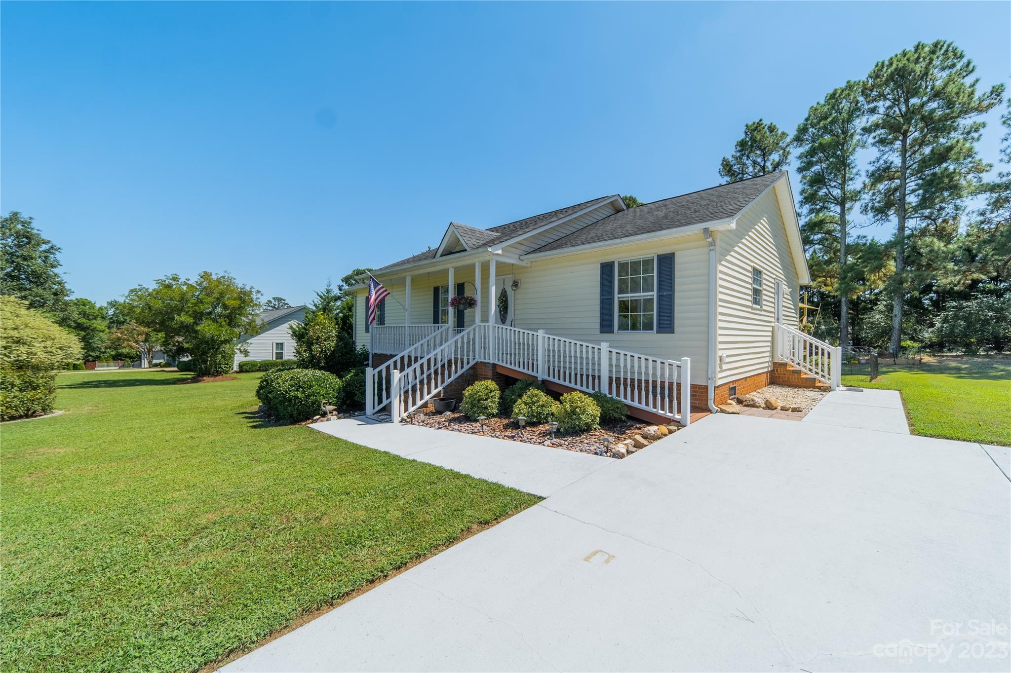 1585 Wimbleton Woods Drive Fort Mill, SC 29708 - Photo 6 of 41 a front view of house with yard and green space