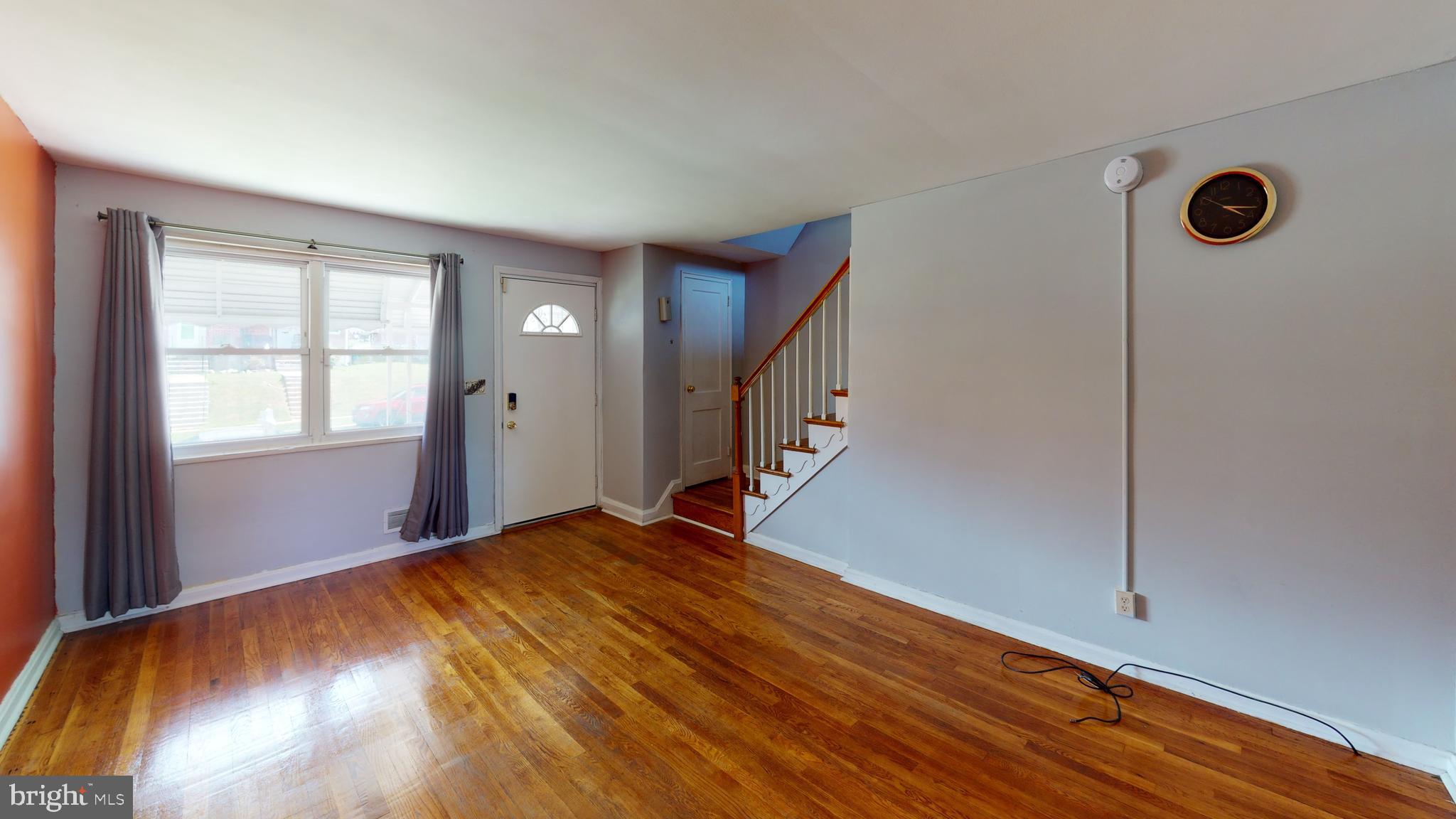5438 Channing Road Baltimore, MD 21229 - Photo 15 of 20 a view of a livingroom with wooden floor