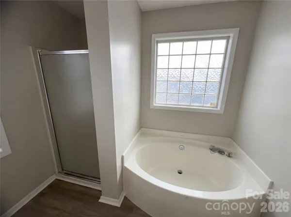 a white bath tub sitting in a bathroom