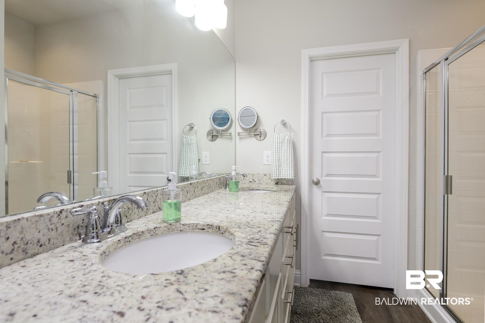 31751 Kestrel Loop Daphne, AL 36527 - Photo 15 of 21 Bathroom with a stall shower, vanity, and dark wood-type flooring