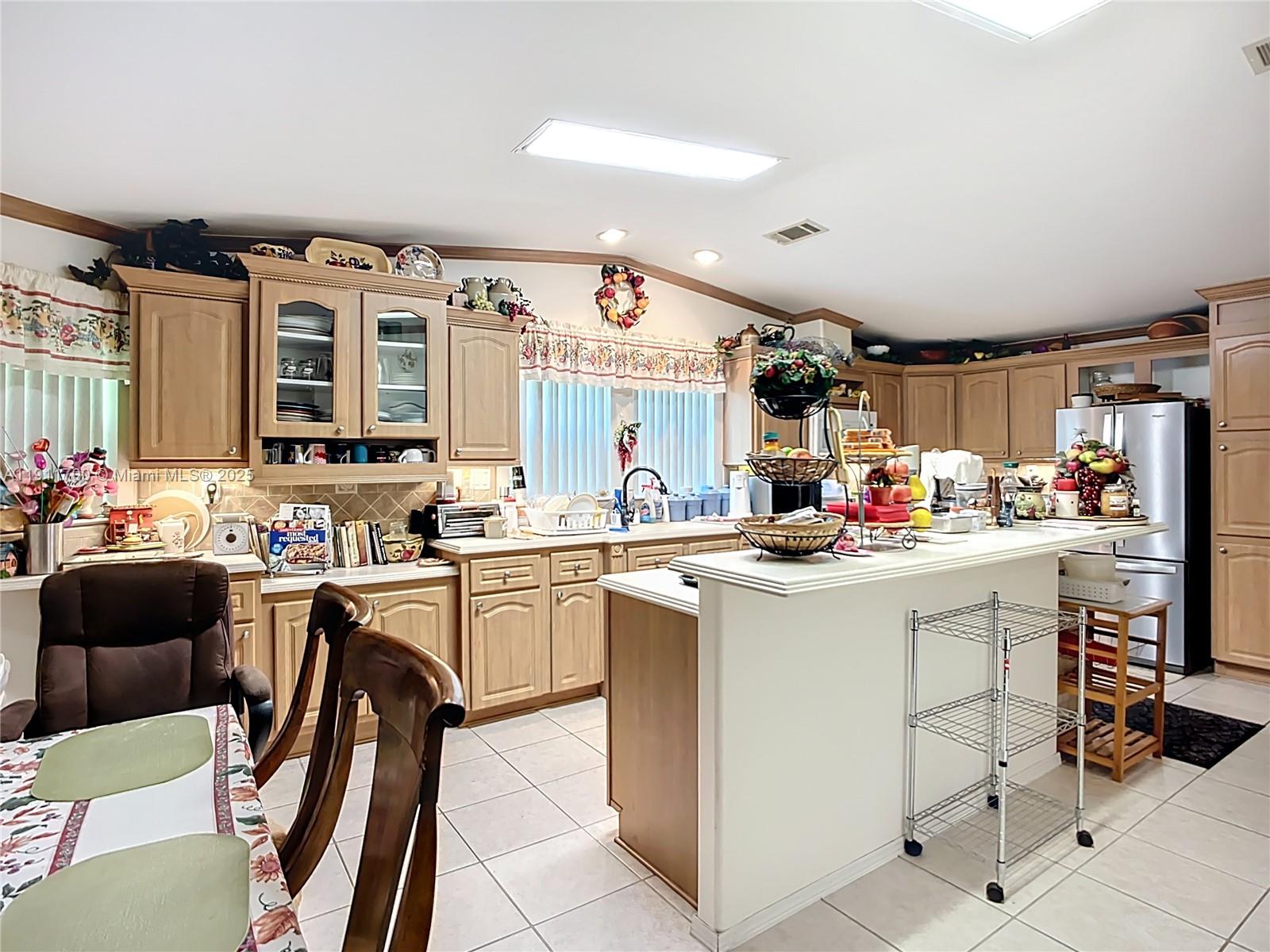 1432 Silver Lake Road LaBelle, FL 33935 - Photo 12 of 39 a kitchen that has a lot of cabinets in it and appliances
