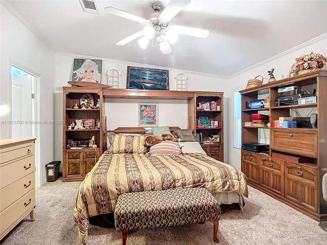 a bedroom with a bed and furniture