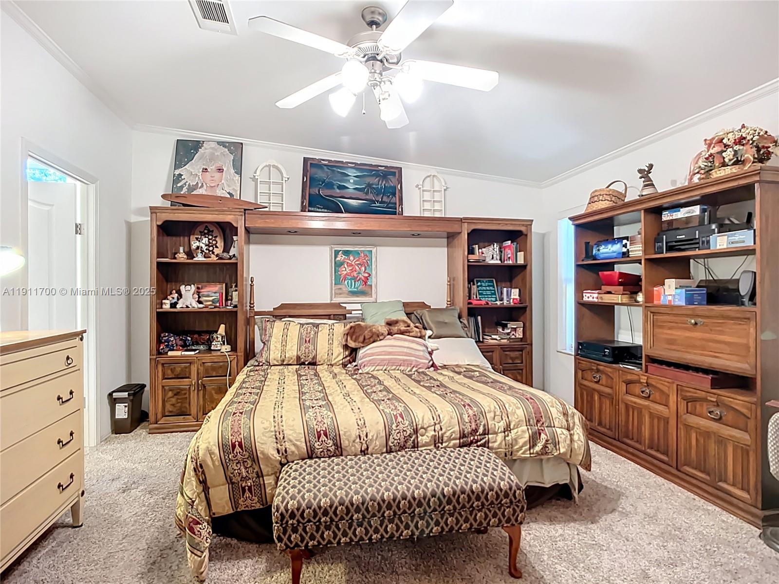 1432 Silver Lake Road LaBelle, FL 33935 - Photo 16 of 39 a bedroom with a bed and furniture