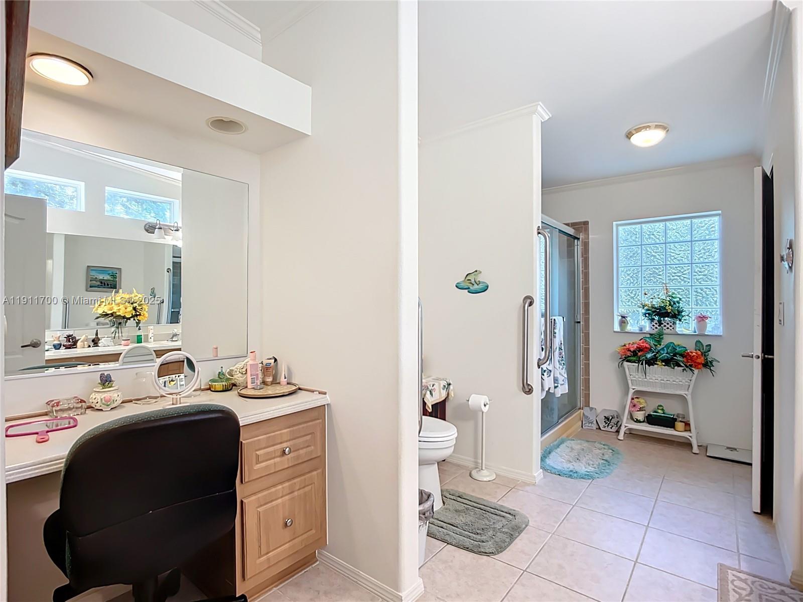1432 Silver Lake Road LaBelle, FL 33935 - Photo 17 of 39 a bathroom with a sink a toilet and a mirror