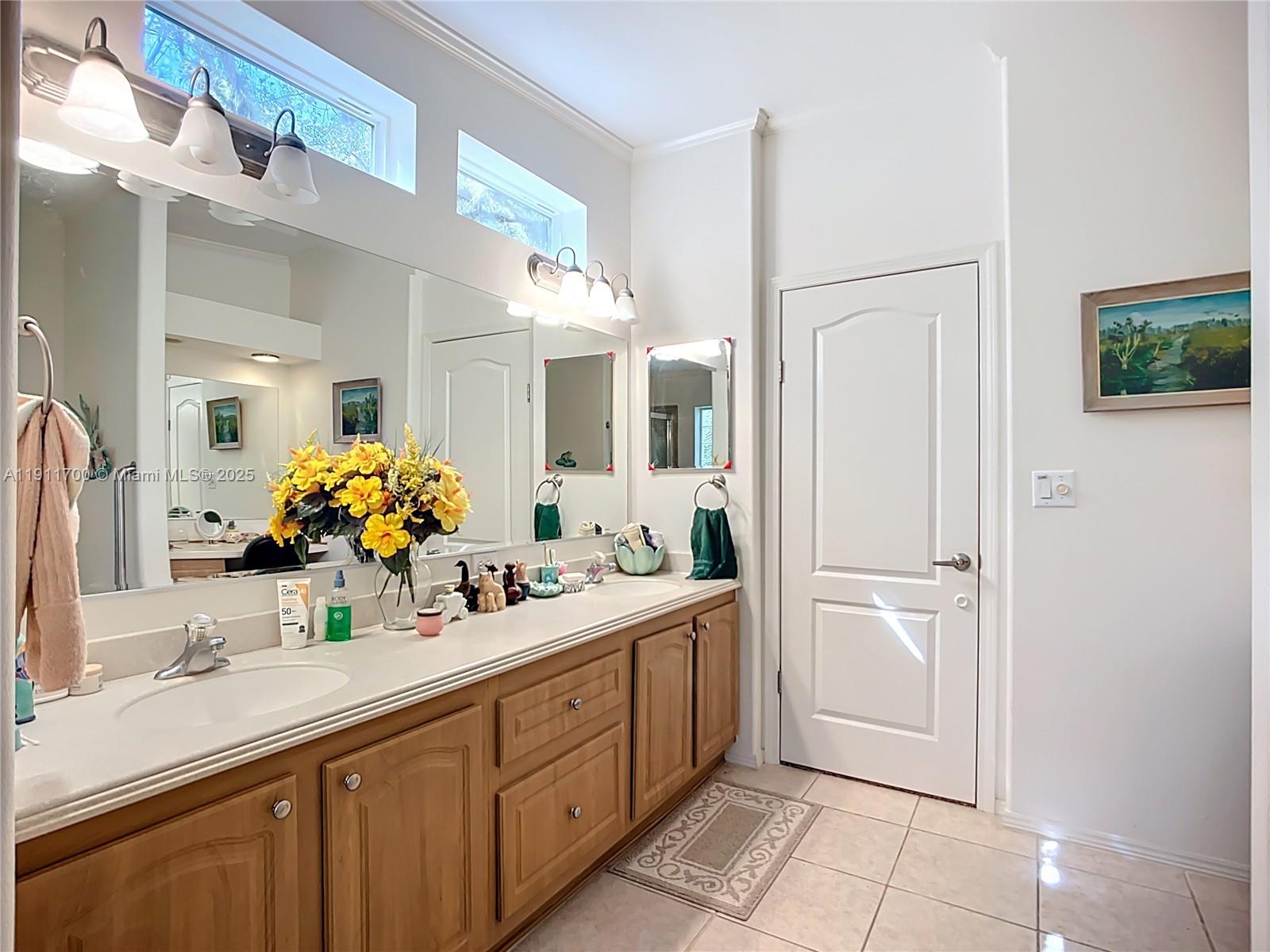 1432 Silver Lake Road LaBelle, FL 33935 - Photo 20 of 39 a spacious bathroom with a double vanity sink and a mirror