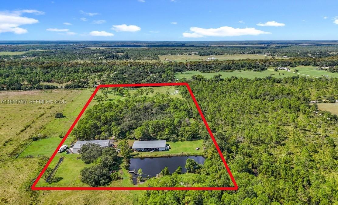 1432 Silver Lake Road LaBelle, FL 33935 - Photo 2 of 39 a view of a pathway with a garden