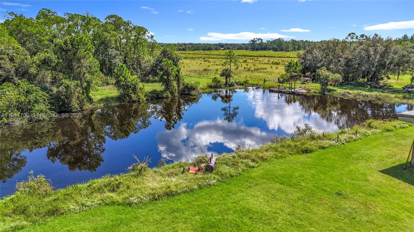 1432 Silver Lake Road LaBelle, FL 33935 - Photo 39 of 39 a view of a lake with a yard