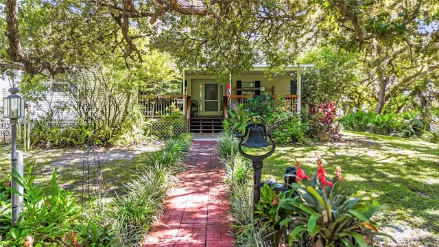 a backyard of a house with lots of green space and trees