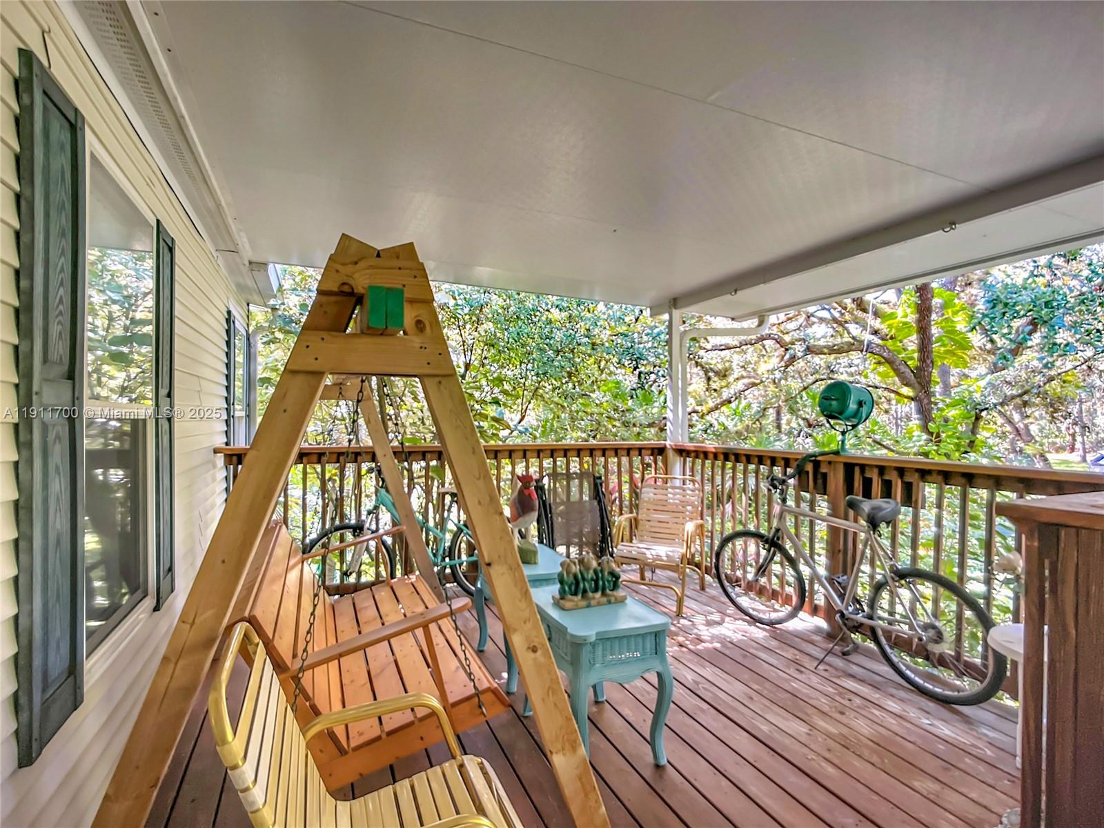 1432 Silver Lake Road LaBelle, FL 33935 - Photo 7 of 39 a view of a balcony with wooden floor