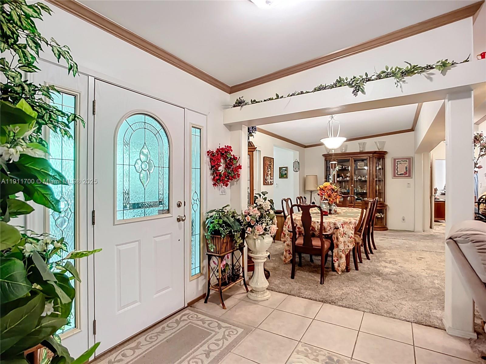 1432 Silver Lake Road LaBelle, FL 33935 - Photo 9 of 39 a view of a porch with a dining table and chairs
