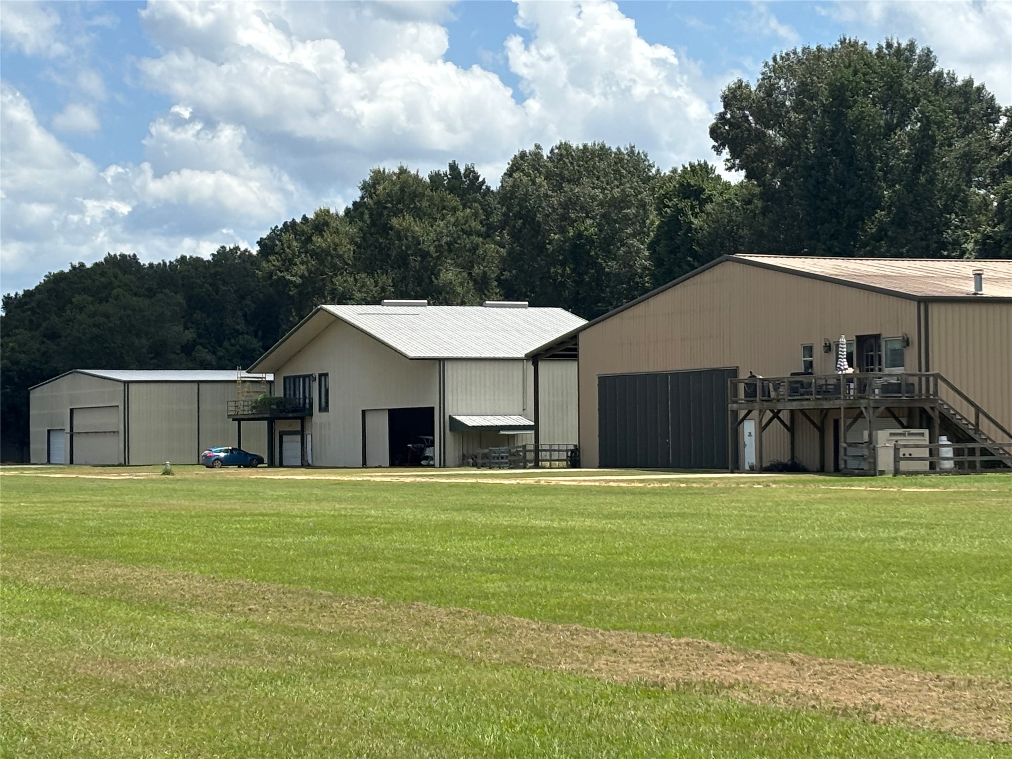 141 Walnut Loop Shepherd, TX 77371 - Photo 36 of 50 This is an example of the “Hanger Houses” where owners live in the airplane hangers along the landing strip-