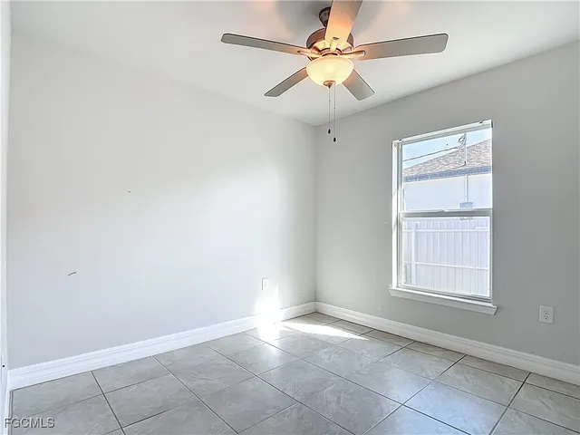 an empty room with fan