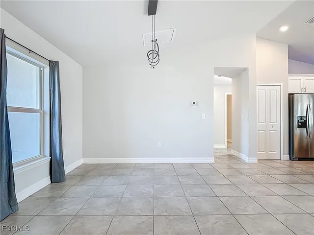 a view of a hallway to rooms