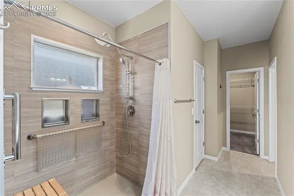 a bathroom with a shower and a sink