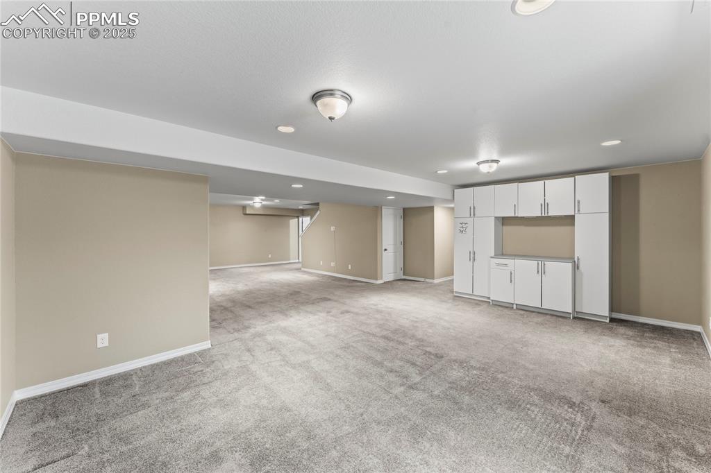 6208 Ashmore Road Colorado Springs, CO 80927 - Photo 35 of 50 Finished below grade area with light colored carpet and recessed lighting