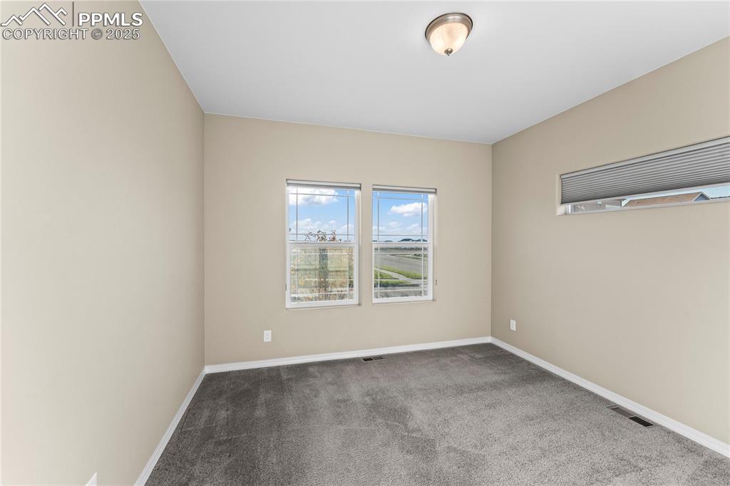 6208 Ashmore Road Colorado Springs, CO 80927 - Photo 10 of 50 Spare room with carpet floors and baseboards