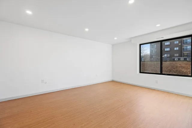 a view of hallway with wooden floor