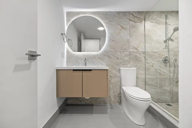 a bathroom with a toilet and a sink