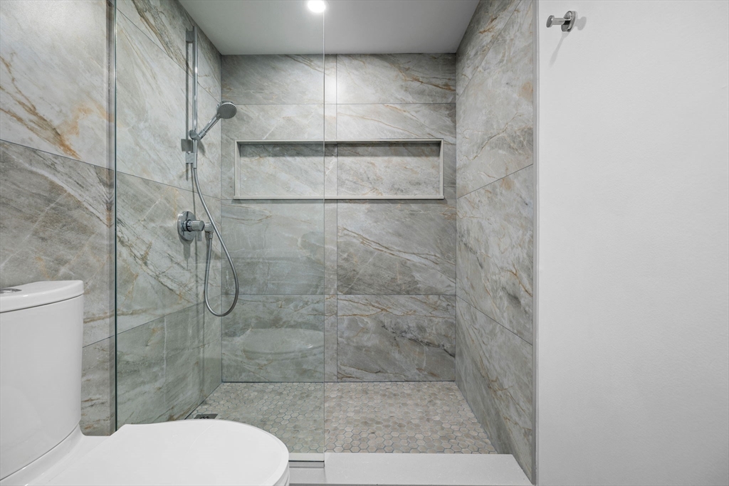 1243 Beacon Street, Unit 5A Brookline, MA 02446 - Photo 8 of 21 a bathroom with a toilet and a shower
