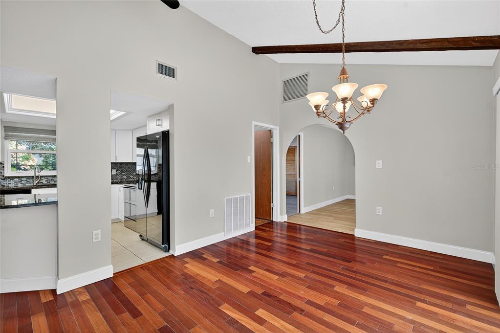 302 Leafwood Road Tarpon Springs, FL 34689 - Photo 16 of 55 a view of a livingroom with wooden floor