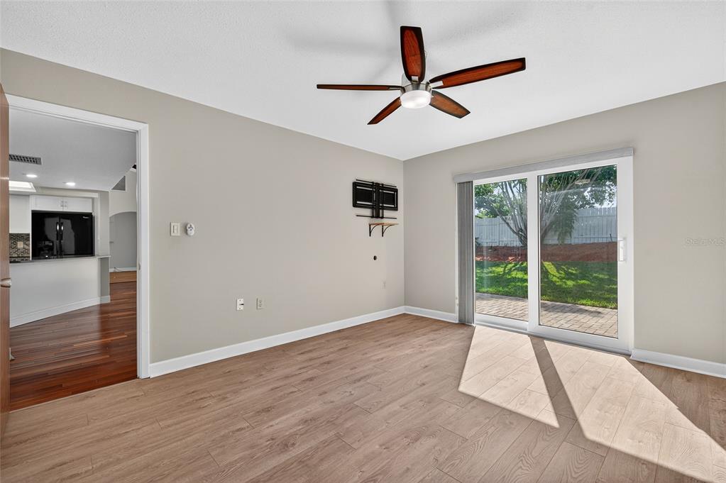 302 Leafwood Road Tarpon Springs, FL 34689 - Photo 20 of 55 a view of a livingroom with a ceiling fan and window