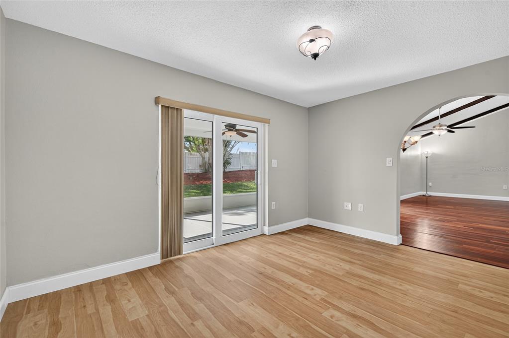 302 Leafwood Road Tarpon Springs, FL 34689 - Photo 34 of 55 a view of an empty room with wooden floor and a window