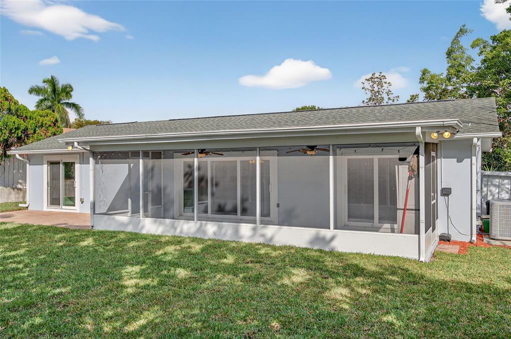 302 Leafwood Road Tarpon Springs, FL 34689 - Photo 48 of 55 a view of a house with backyard and porch