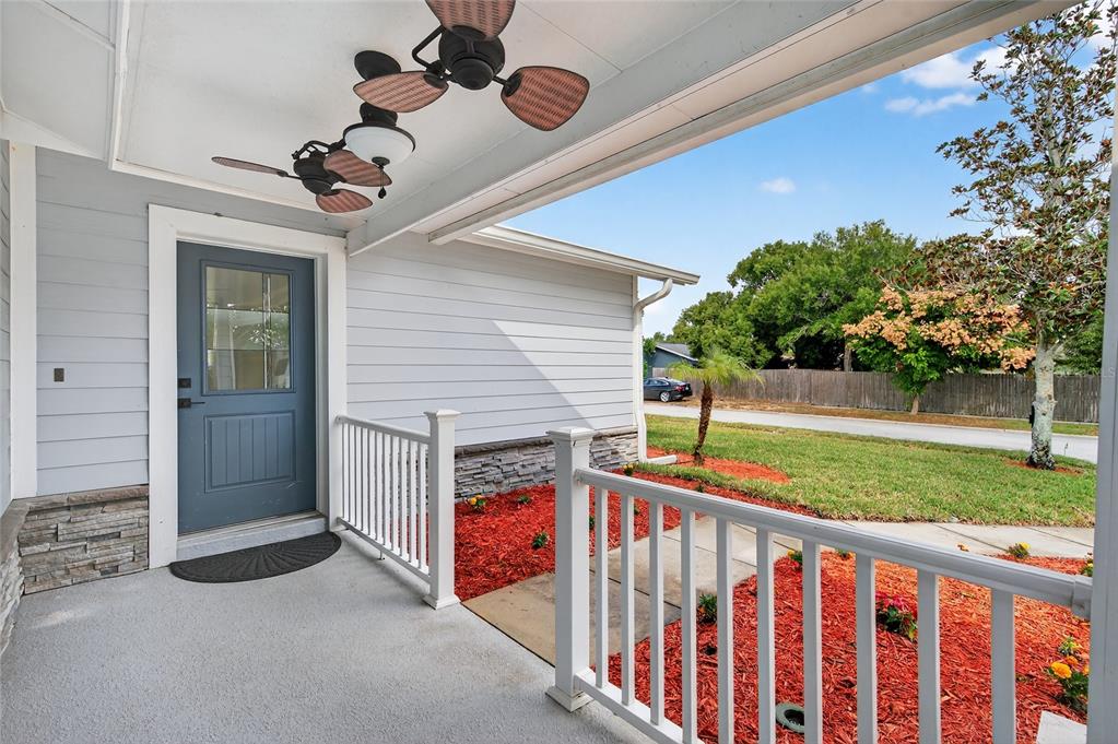 302 Leafwood Road Tarpon Springs, FL 34689 - Photo 6 of 55 a view of a porch and garden