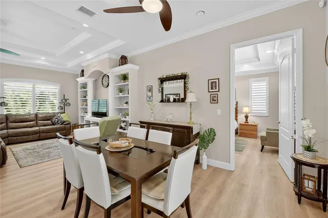 a living room with furniture workspace and a flat screen tv