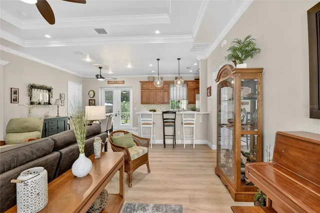 a spacious bedroom with a bed and a chandelier