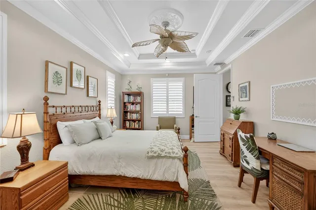 a bathroom with a granite countertop tub a sink and a window
