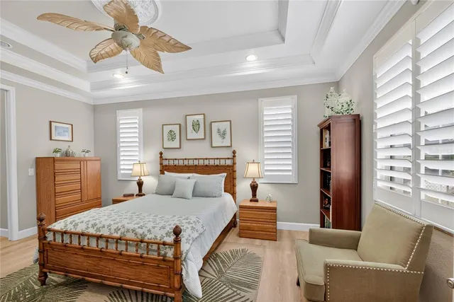 a bathroom with a granite countertop sink a large mirror a bathtub and window