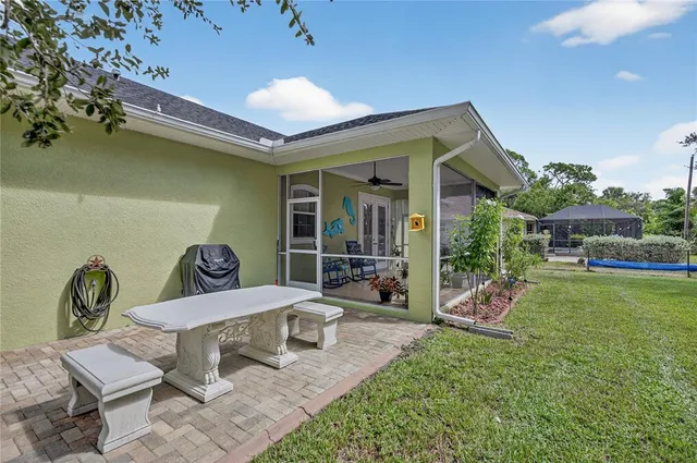a view of a field with trees in the background