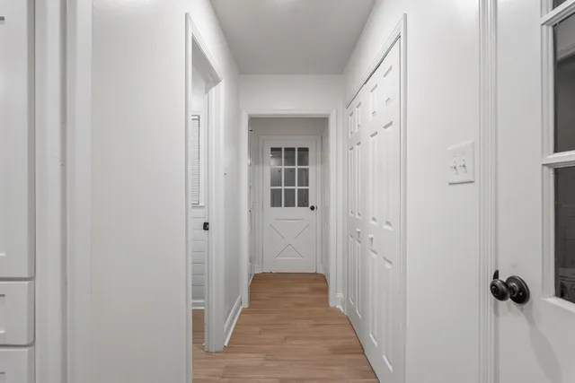 a view of room with wooden floor