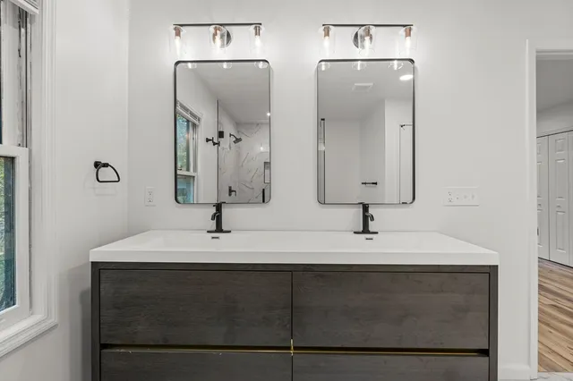 a view of a livingroom with furniture and hardwood floor