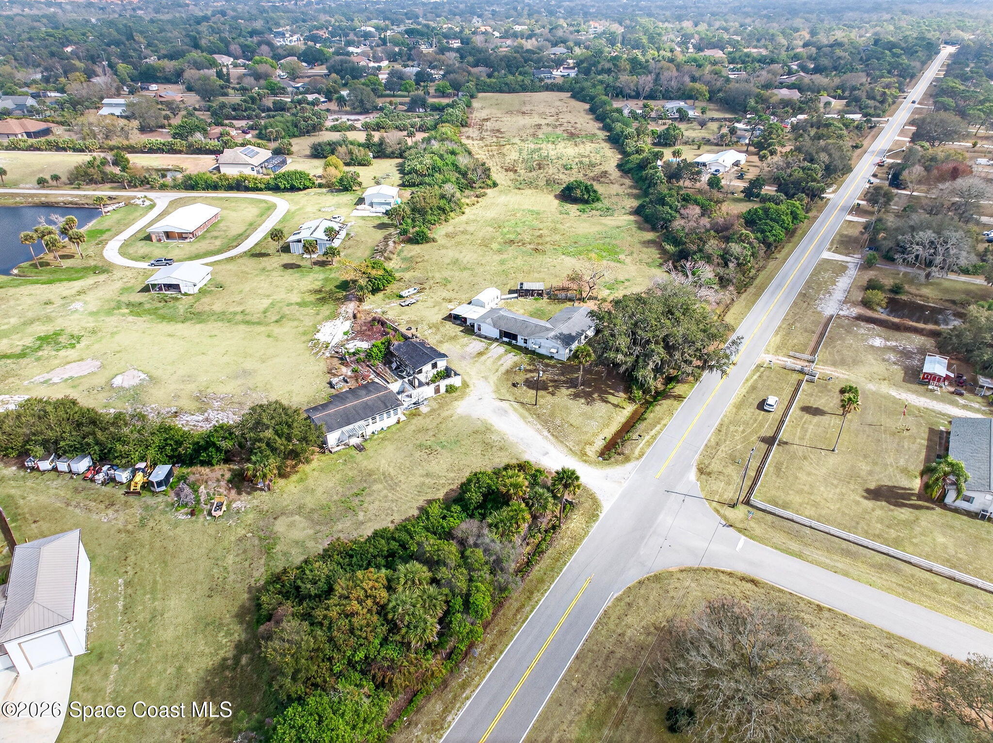 3825 Turtle Mound Road Melbourne, FL 32934 - Photo 11 of 19 an aerial view of residential houses with outdoor space