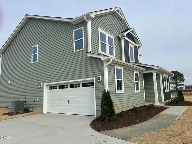 a front view of a house with a garage
