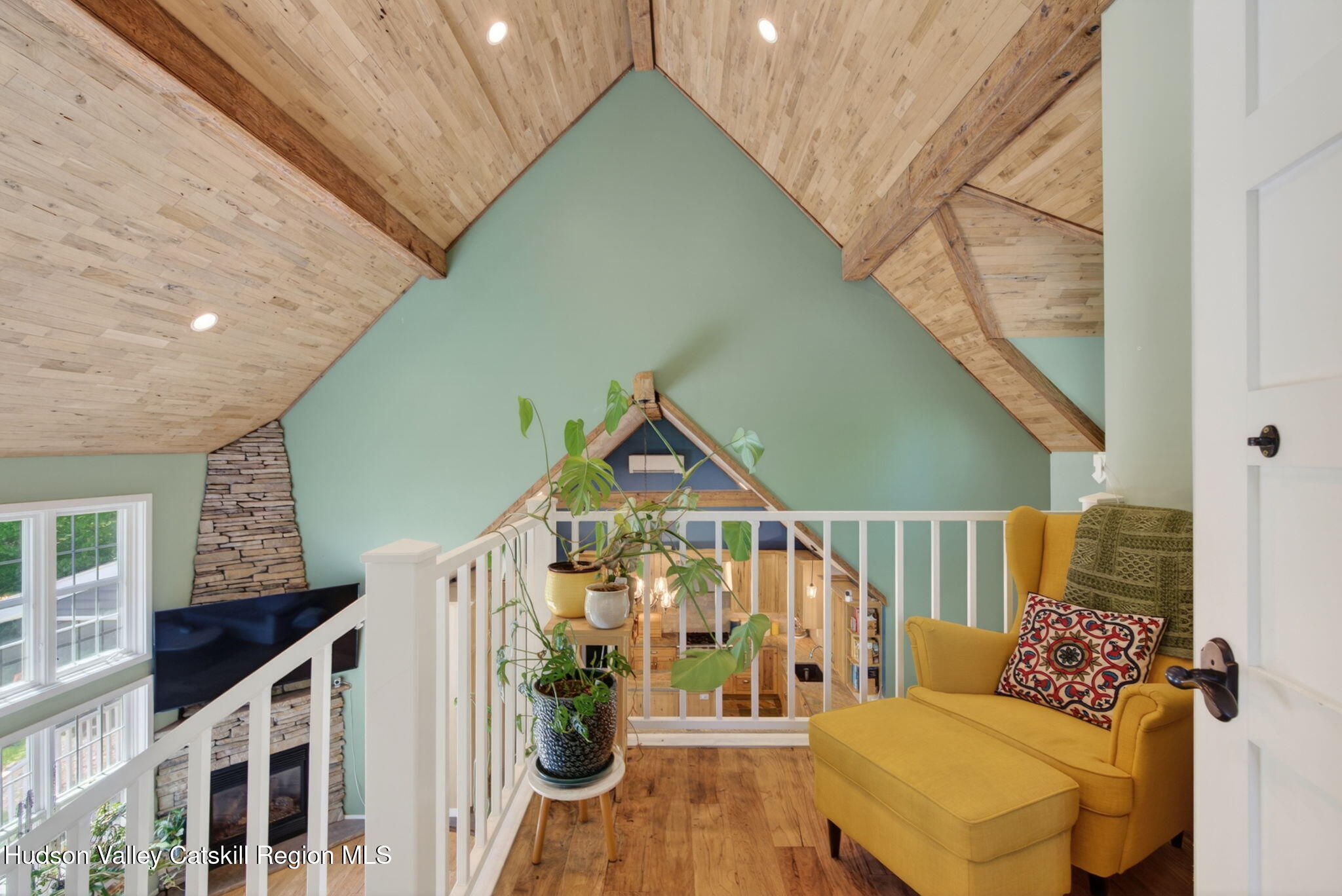 322 Morrison Road Acra, NY 12405 - Photo 16 of 49 a view of a couches with wooden floor and stairs