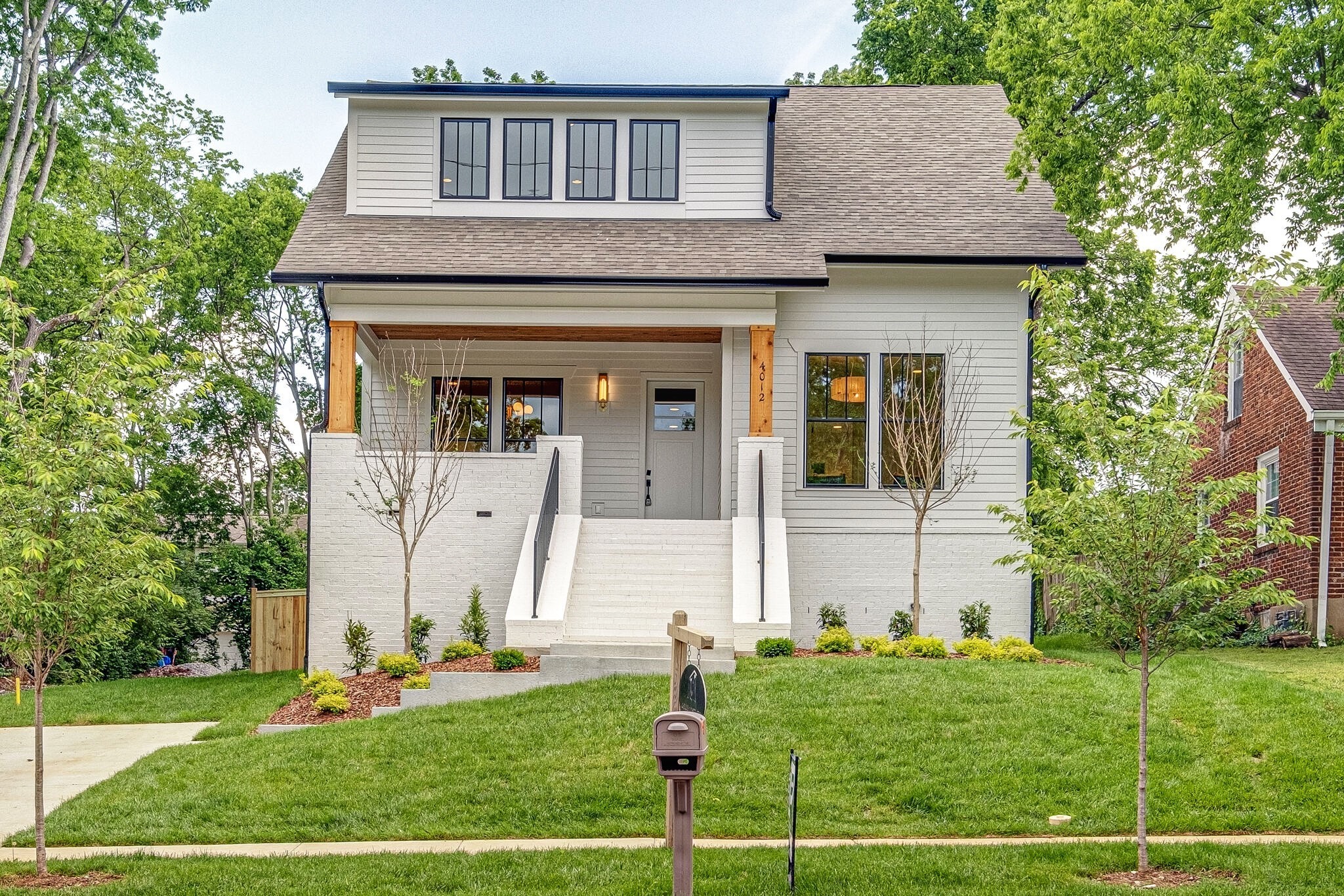 4012 Murphy Road Nashville, TN 37209 - Photo 1 of 63 a front view of a house with a yard
