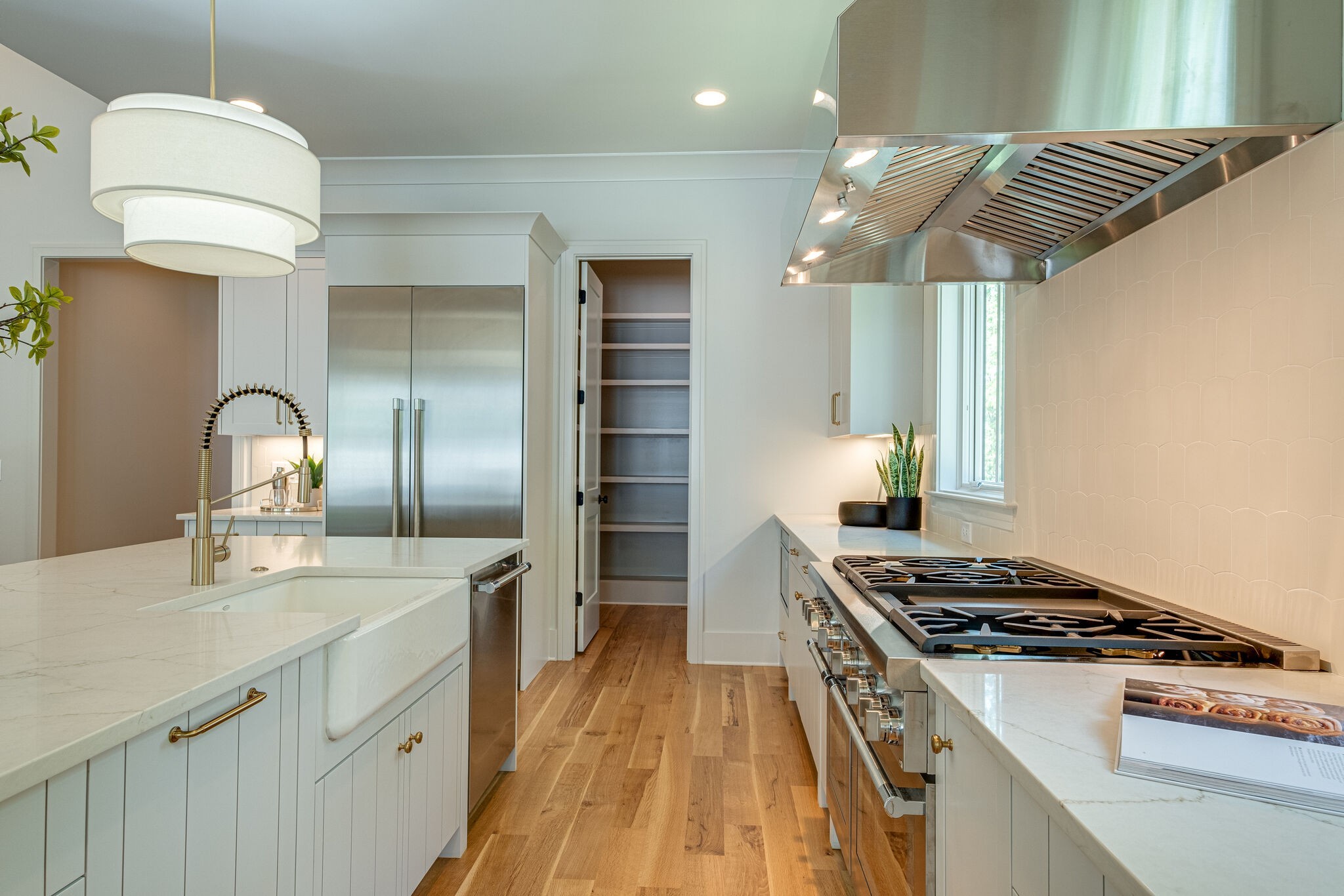 4012 Murphy Road Nashville, TN 37209 - Photo 16 of 63 a kitchen with kitchen island a counter space a sink and a stove