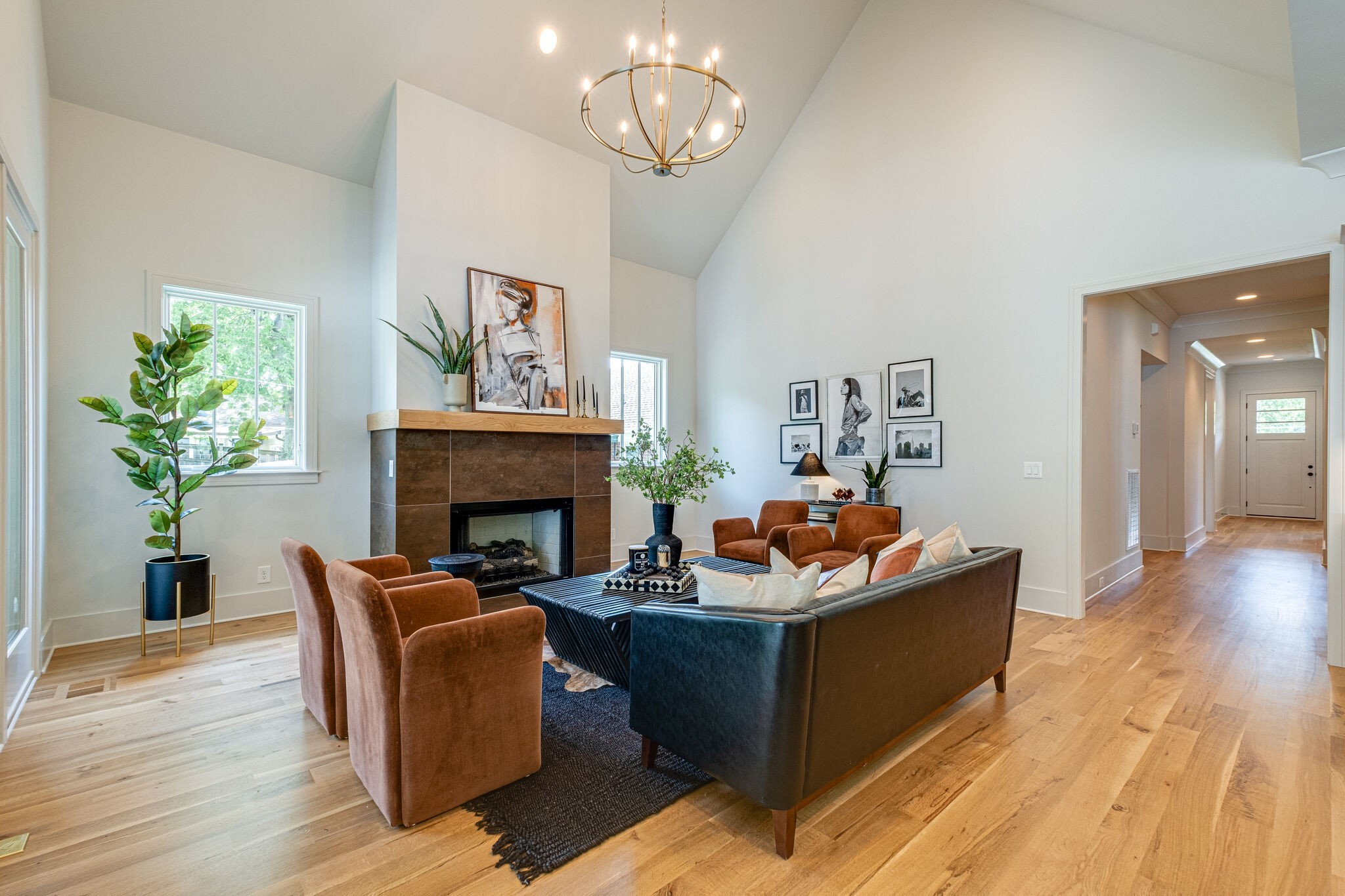 4012 Murphy Road Nashville, TN 37209 - Photo 24 of 63 a living room with furniture a fireplace and paintings on the wall