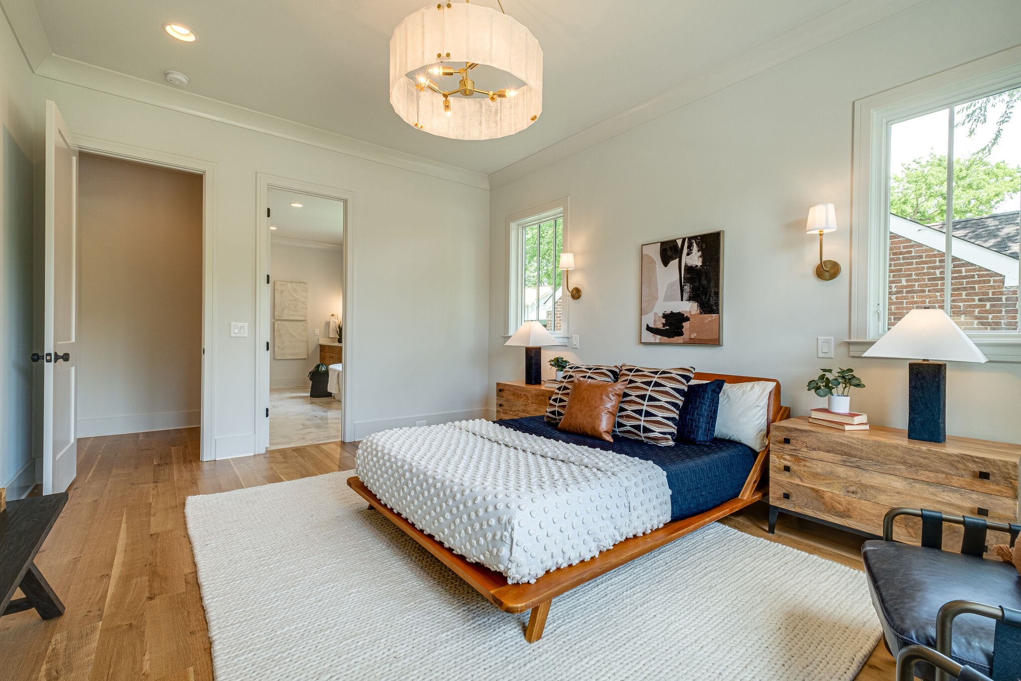 4012 Murphy Road Nashville, TN 37209 - Photo 29 of 63 a bedroom with a bed and a chandelier