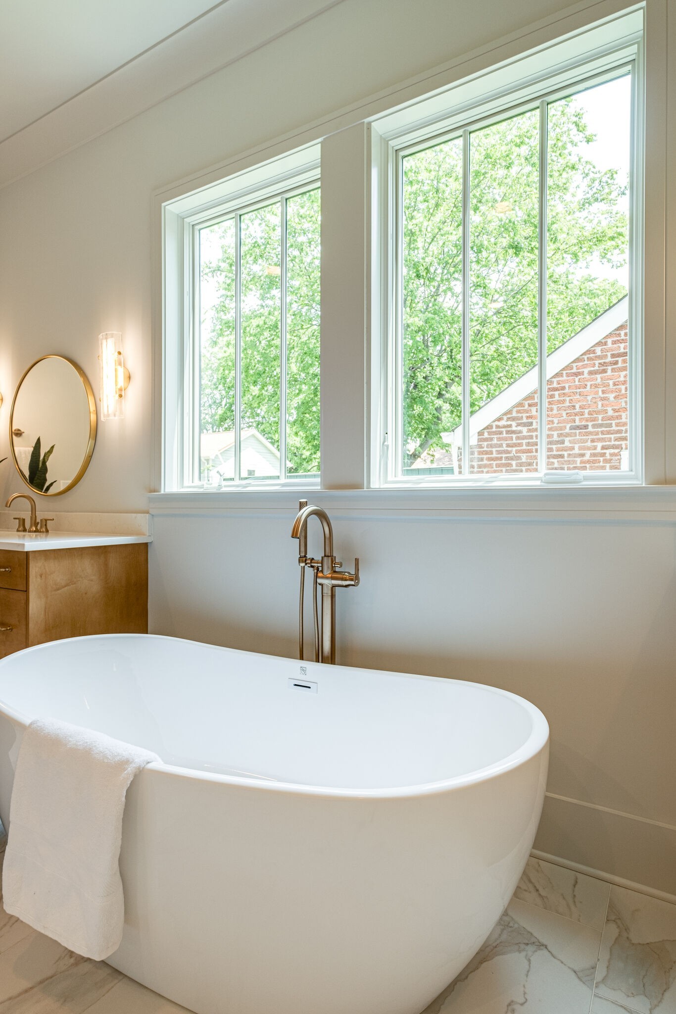 4012 Murphy Road Nashville, TN 37209 - Photo 34 of 63 a white bath tub sitting in a bathroom next to a window