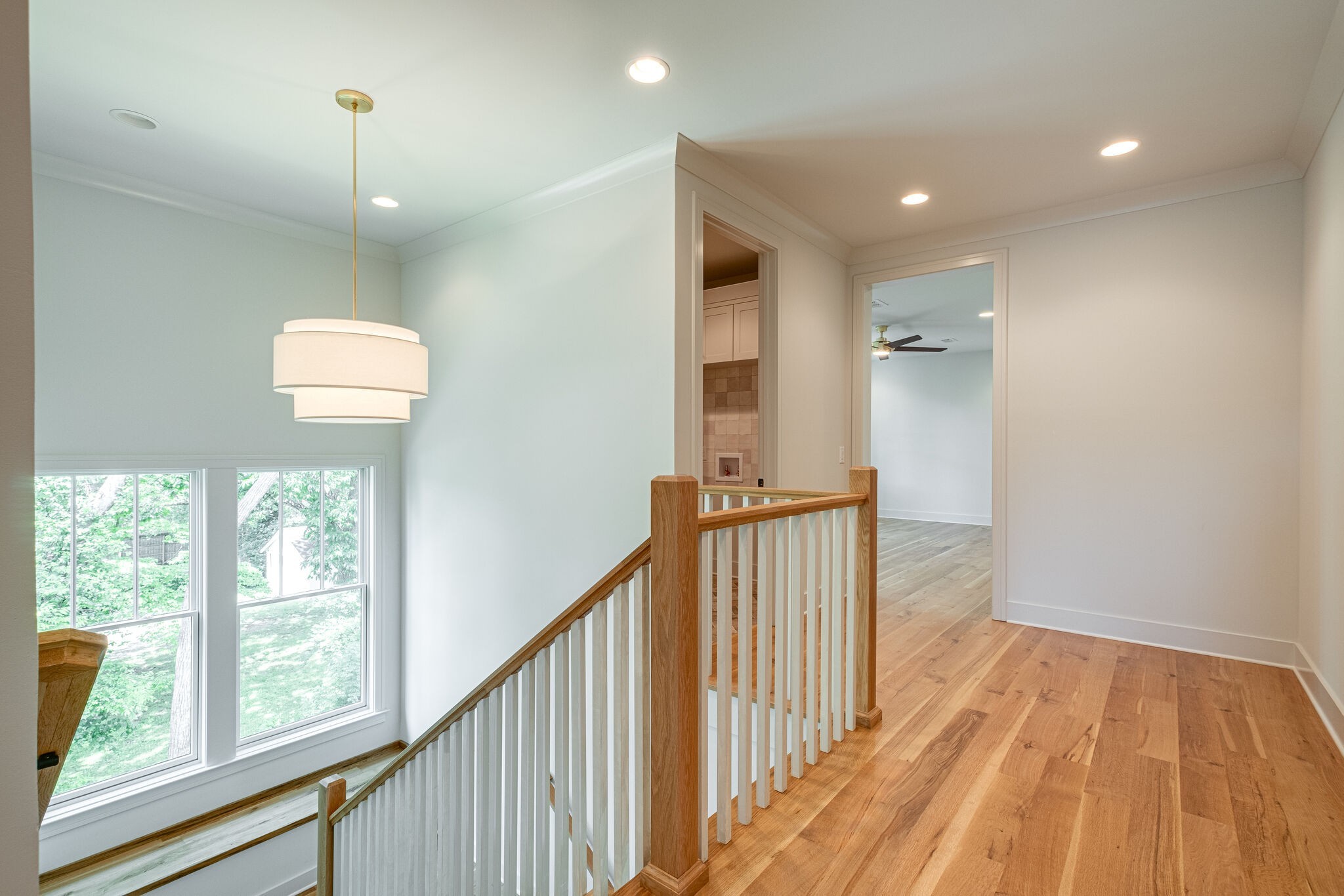 4012 Murphy Road Nashville, TN 37209 - Photo 42 of 63 a view of a hallway with wooden floor and stairs