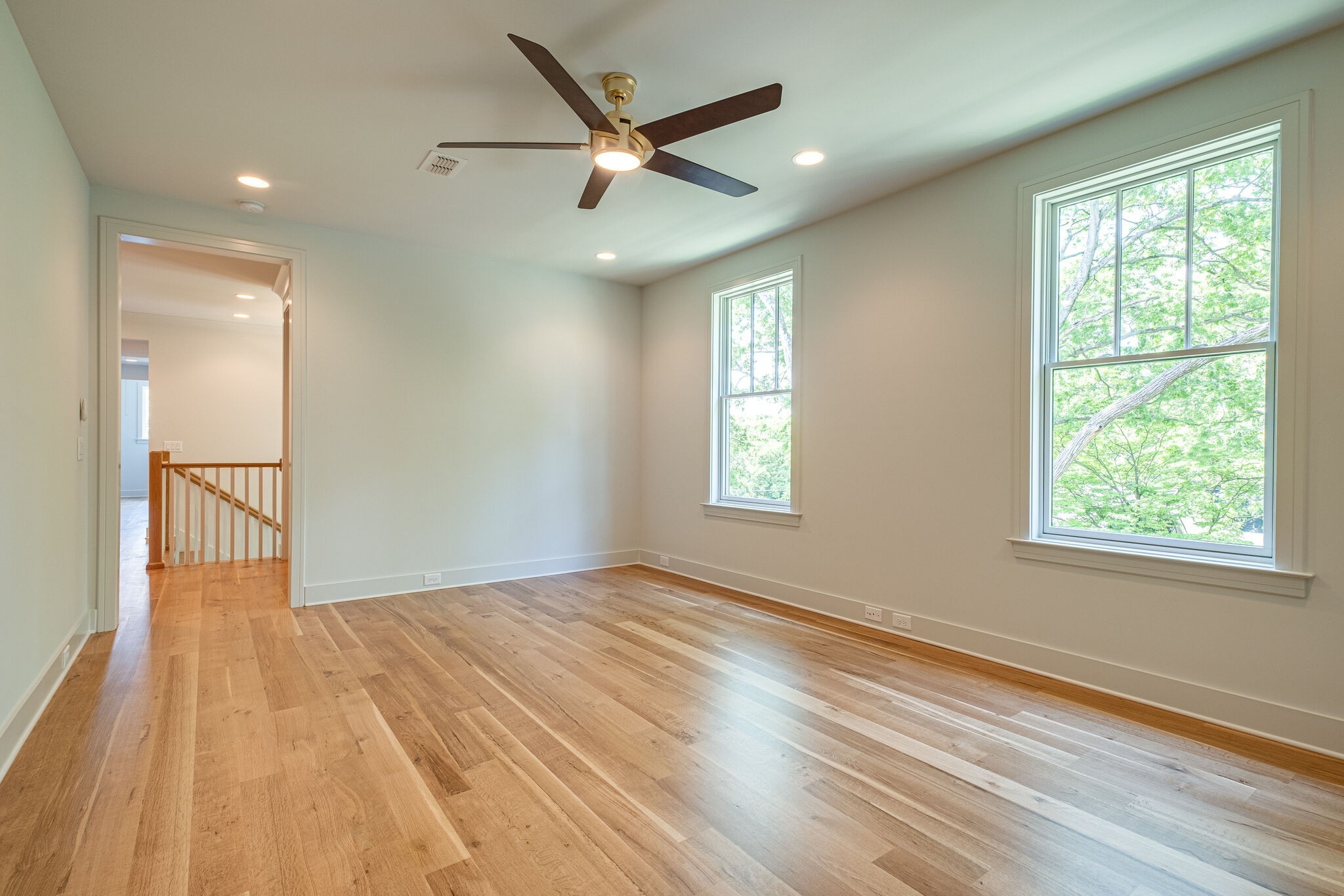 4012 Murphy Road Nashville, TN 37209 - Photo 44 of 63 an empty room with wooden floor fan and windows
