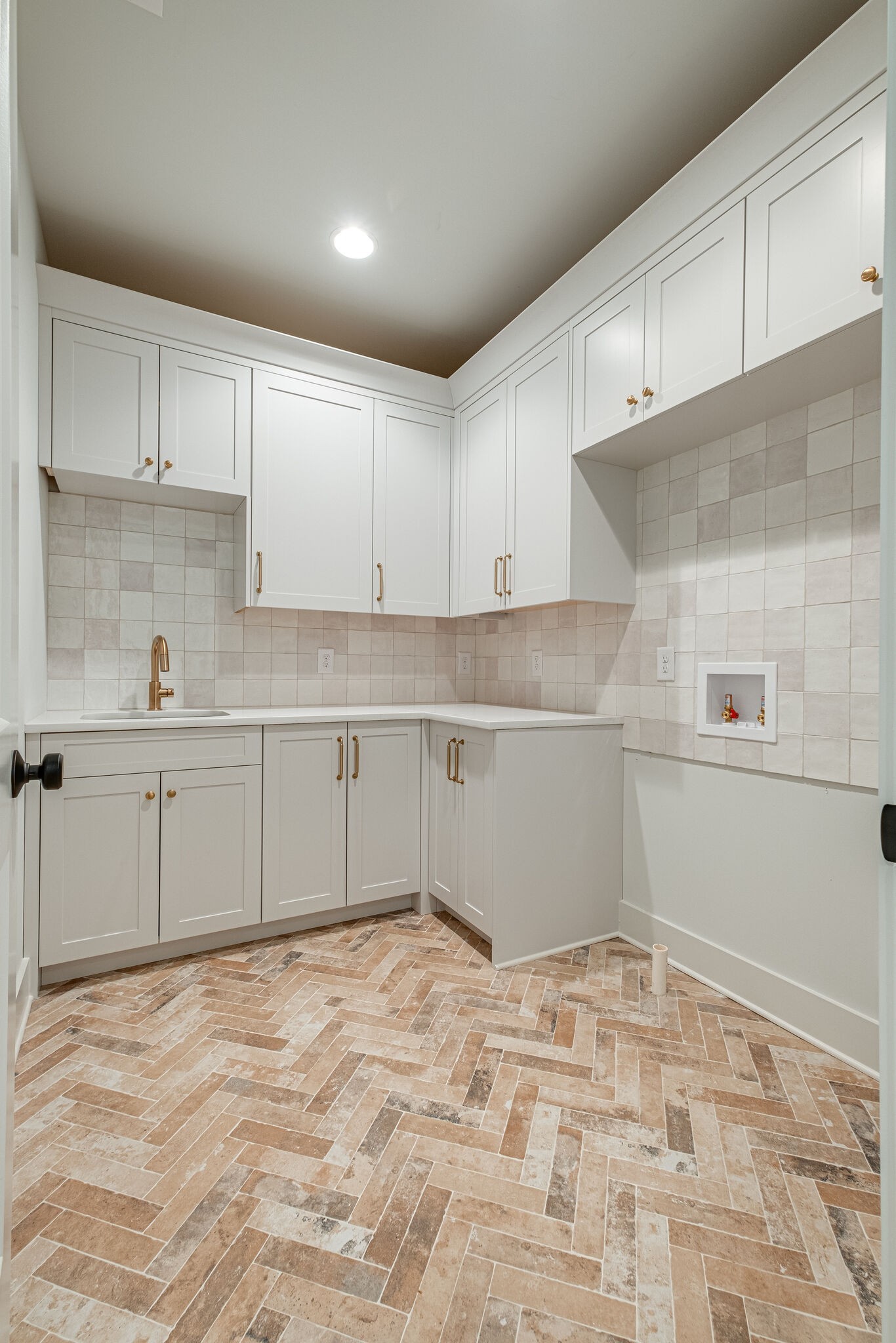 4012 Murphy Road Nashville, TN 37209 - Photo 45 of 63 a kitchen with white cabinets and sink