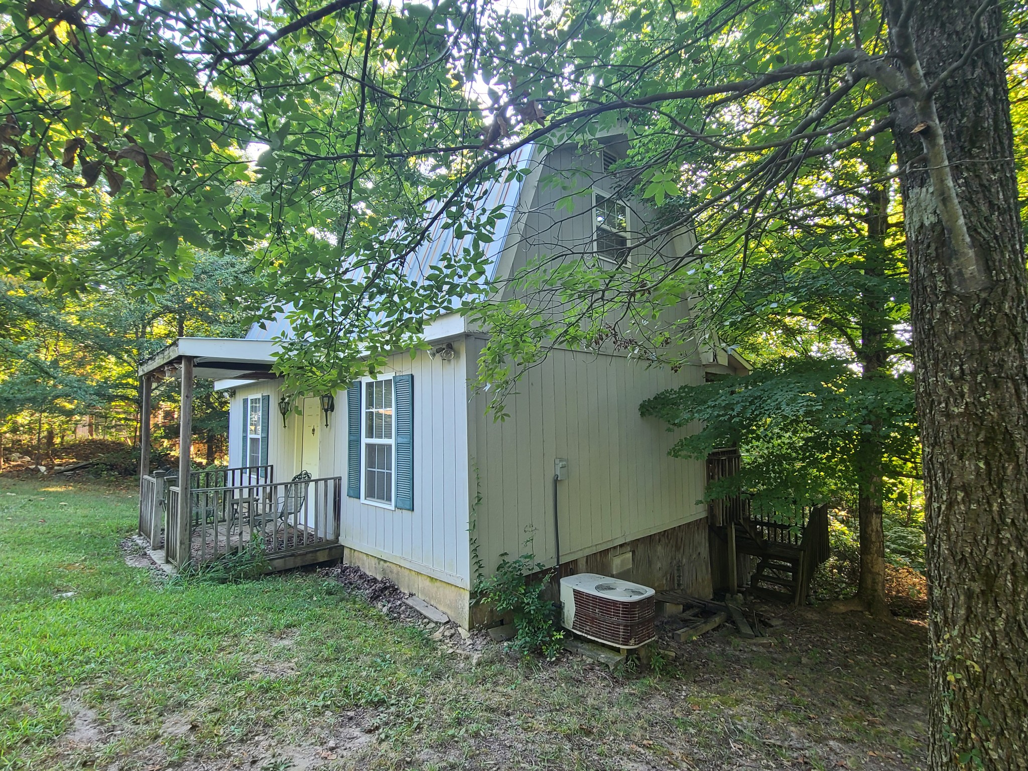 477 Leatherwood Lake Road Stewart, TN 37175 - Photo 3 of 10 a view of a house with backyard and a tree