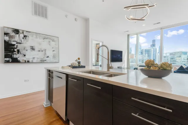 a kitchen with a sink and a refrigerator
