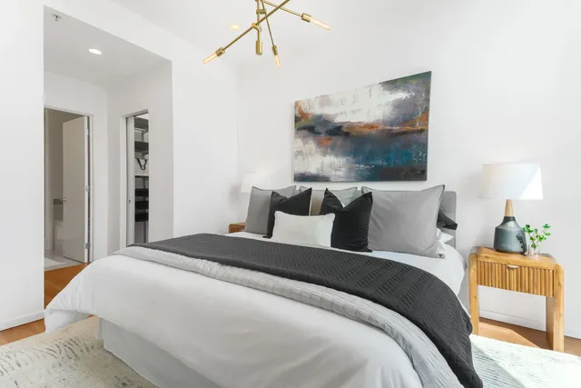 a bedroom with bed and window